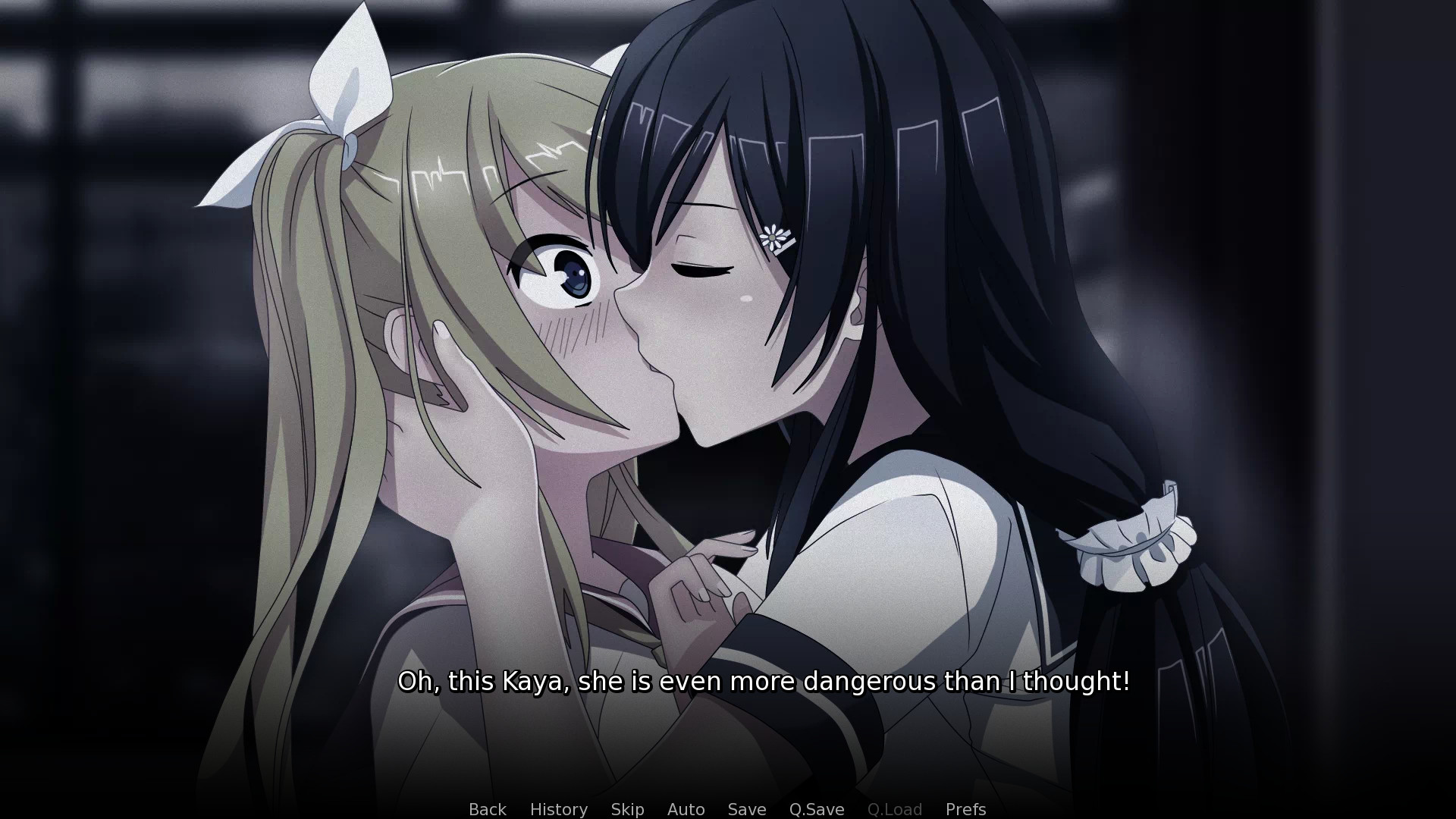 Two feminine characters kissing. Text below them says 'Oh, this is Kaya, she is even more dangerous than I thought!'